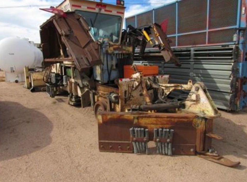 TWO NORDCO GROUNDHOG BALLAST REGULATOR RAILROAD MACHINES